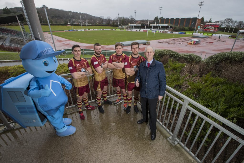 Blue mascot standing in Stadium Zipworld with our Chief Executive Andrew Bowden