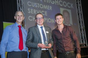 Jon Highcock wins award with Andrew Bowden our Chief Executive and Ash Dykes at our Colleague Conference 2016 at Venue Cymru